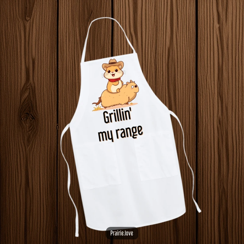 Funny prairie dog cowboy apron, a cheerful prairie dog in a tiny cowboy hat riding a galloping tumbleweed, kitchen and western wear.